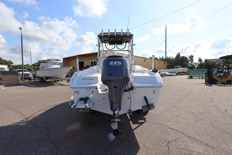 Slide: The Image of 2004 Sea Pro 220 Walk Around boat with 225 horsepower engine, parked outdoors. - 6