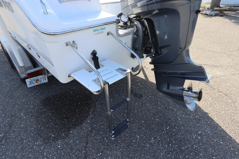 Slide: The Image of 2004 Sea Pro 220 Walk Around boat with outboard motor and swim ladder. - 7