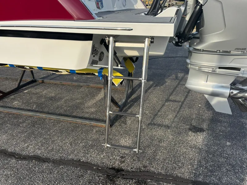 Slide: The Image of 2024 Cobalt R8 Outboard boat with ladder and engine detail. - 10