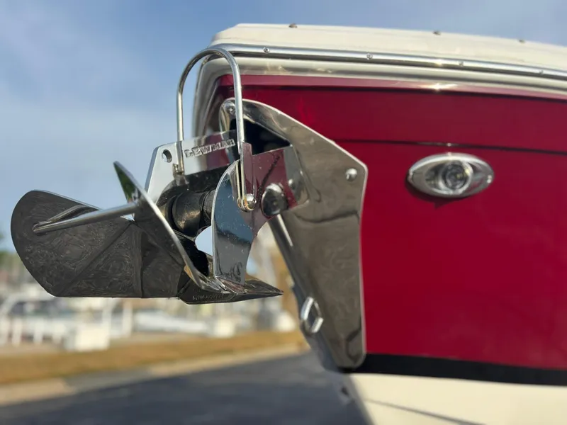 Slide: The Image of 2024 Cobalt R8 Outboard boat with a shiny anchor and red hull. - 15