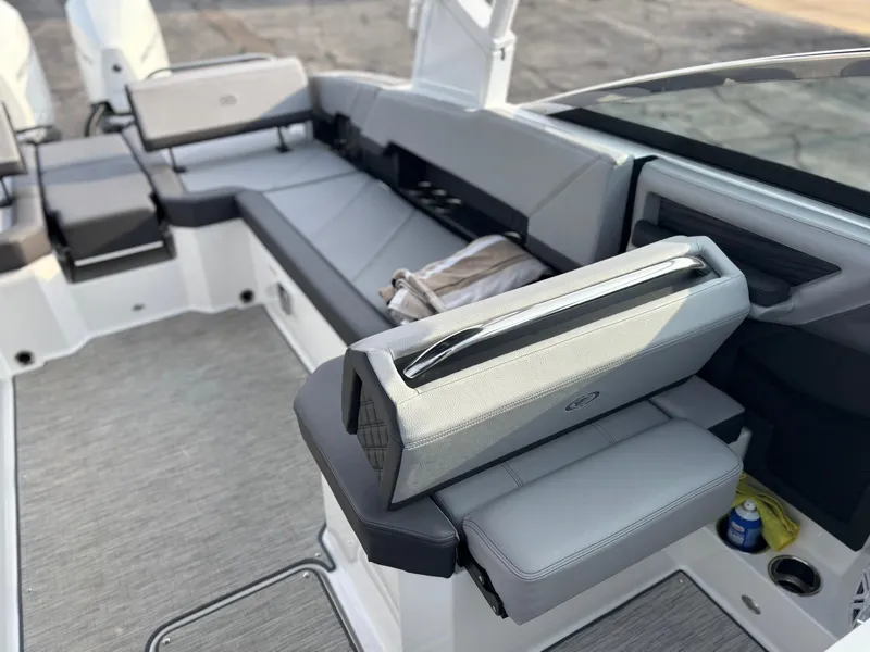 Slide: The Image of 2024 Cobalt R8 Outboard boat interior with sleek gray seating and modern design. - 24