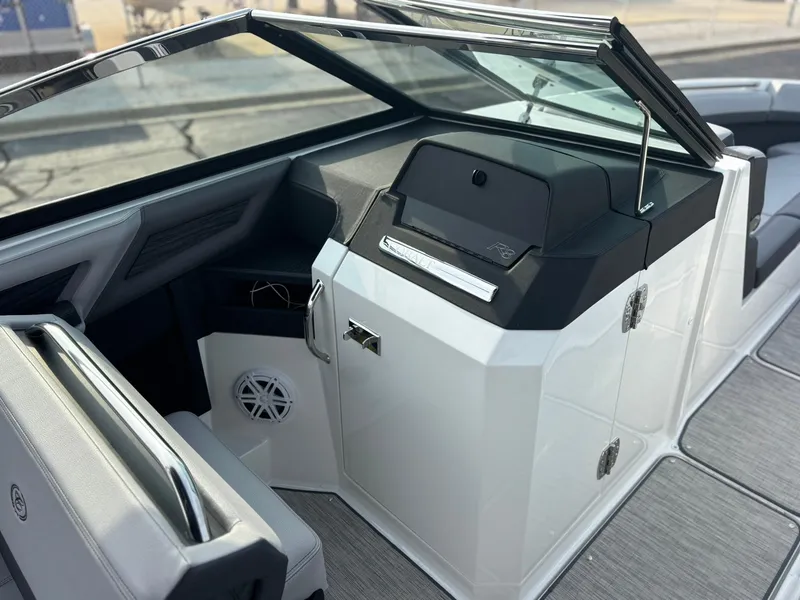 Slide: The Image of 2024 Cobalt R8 Outboard boat interior with sleek dashboard and modern design. - 29