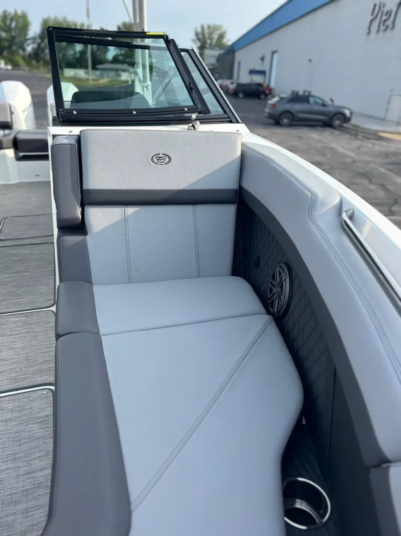 Slide: The Image of 2024 Cobalt R8 Outboard boat interior with gray seating and speaker detail. - 37