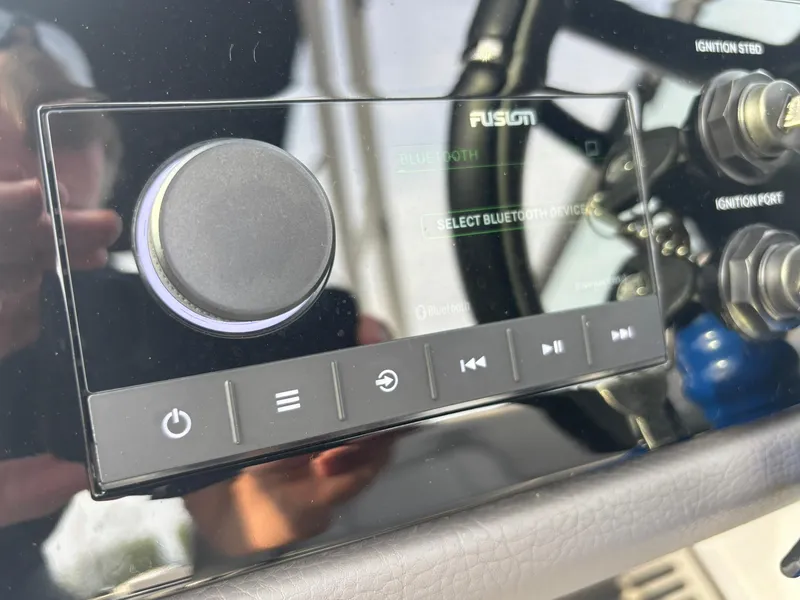 Slide: The Image of 2024 Cobalt R8 Outboard dashboard with Fusion Bluetooth audio controls and ignition switches. - 42