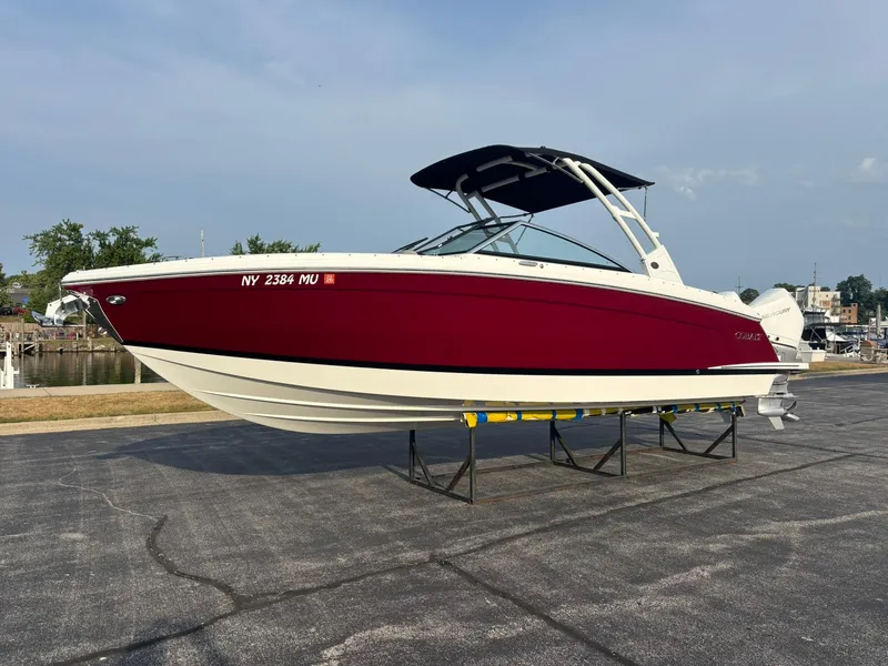 Slide: The Image of 2024 Cobalt R8 Outboard boat with red and white hull on display. - 48