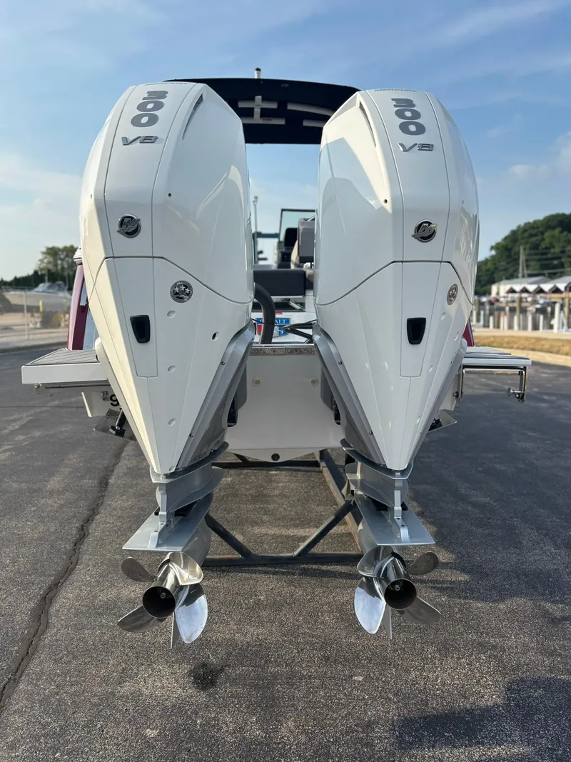 Slide: The Image of 2024 Cobalt R8 Outboard with twin 300 V8 engines, rear view on pavement. - 6