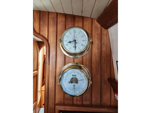 Slide: The Image of Brass clock and barometer on wooden panel, Hans Christian HC33 yacht interior, 1983. - 19