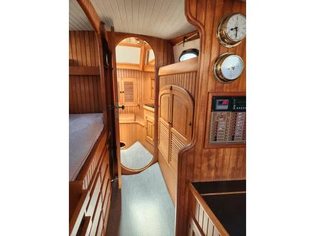Slide: The Image of Interior of 1983 Hans Christian HC33 sailboat with wooden paneling and nautical instruments. - 22