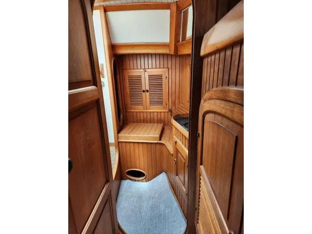 Slide: The Image of 1983 Hans Christian HC33 yacht interior with wooden cabinetry and cozy design. - 27