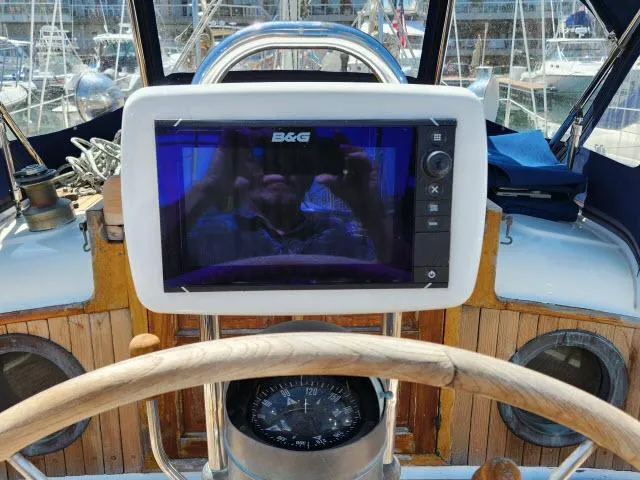 Slide: The Image of Cockpit of 1983 Hans Christian HC33 sailboat with B&G navigation system and wooden steering wheel. - 33