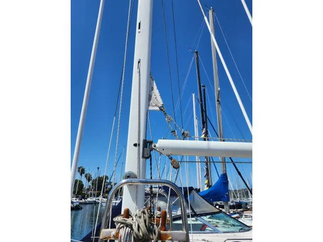 Slide: The Image of Sailboat mast and rigging of 1983 Hans Christian HC33 under clear blue sky. - 42