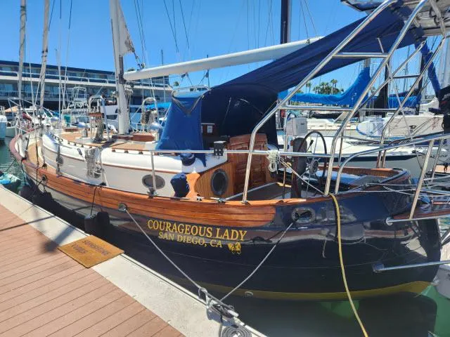 Slide: The Image of 1983 Hans Christian HC33 sailboat "Courageous Lady" docked in San Diego marina. - 44