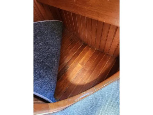 Slide: The Image of Wooden interior of 1983 Hans Christian HC33 boat with partial carpet view. - 47