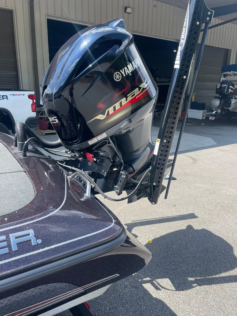 Slide: The Image of 2020 Skeeter ZX 225 boat with Yamaha VMAX outboard motor in a garage setting. - 10