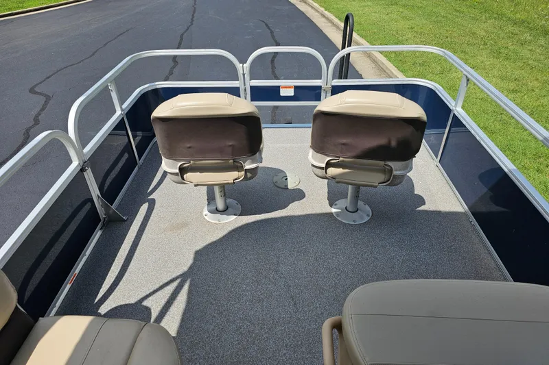 Slide: The Image of 2019 Sun Tracker Bass Buggy 16 DLX pontoon boat interior with two swivel seats. - 4