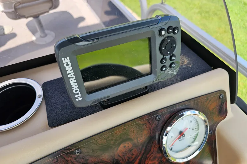Slide: The Image of Fishfinder and RPM gauge on 2019 Sun Tracker Bass Buggy 16 DLX boat dashboard. - 5