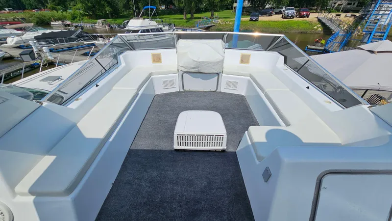 Slide: The Image of 1993 Skipperliner 47 SL boat deck with seating, docked at marina. - 11