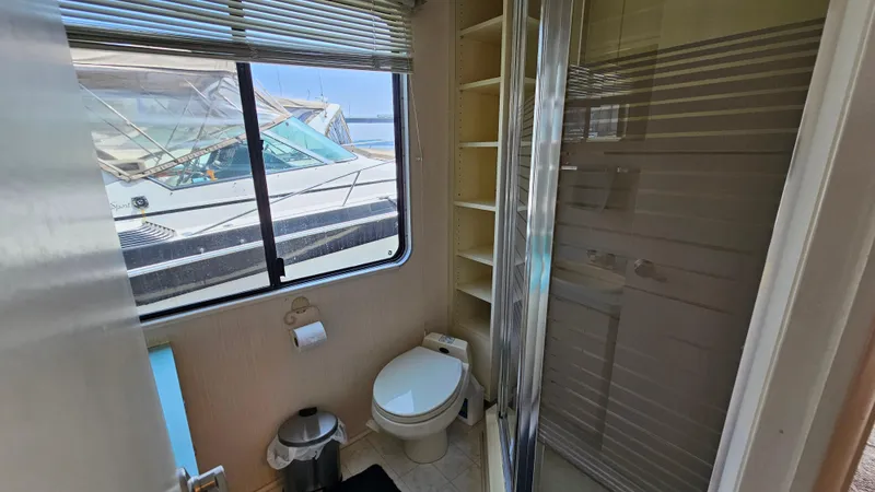 Slide: The Image of Bathroom interior of 1993 Skipperliner 47 SL yacht with window view. - 30