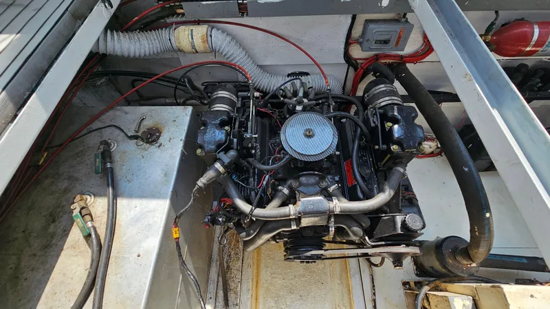 Slide: The Image of Engine compartment of a 1993 Skipperliner 47 SL boat, showing detailed mechanical components. - 37