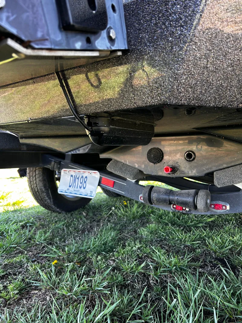 Slide: The Image of 2023 Ranger Z521R Ranger Cup trailer hitch and license plate on grass. - 12