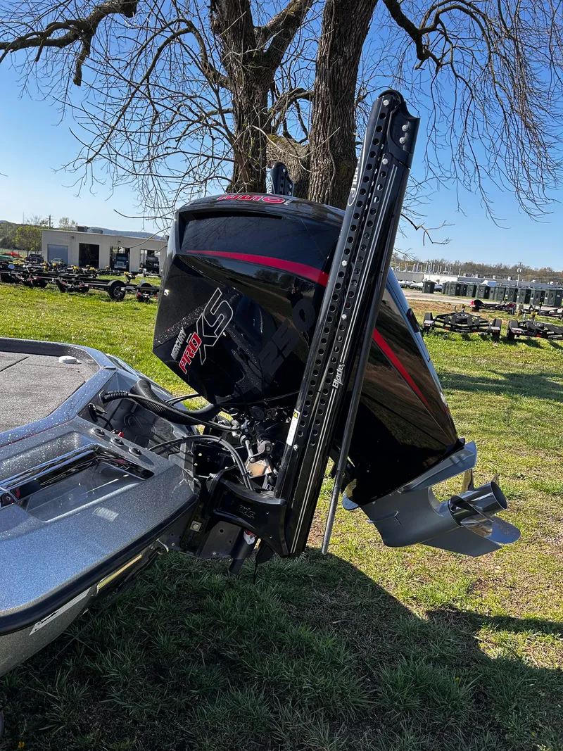 Slide: The Image of 2023 Ranger Z521R boat engine and propeller in a grassy area. - 17
