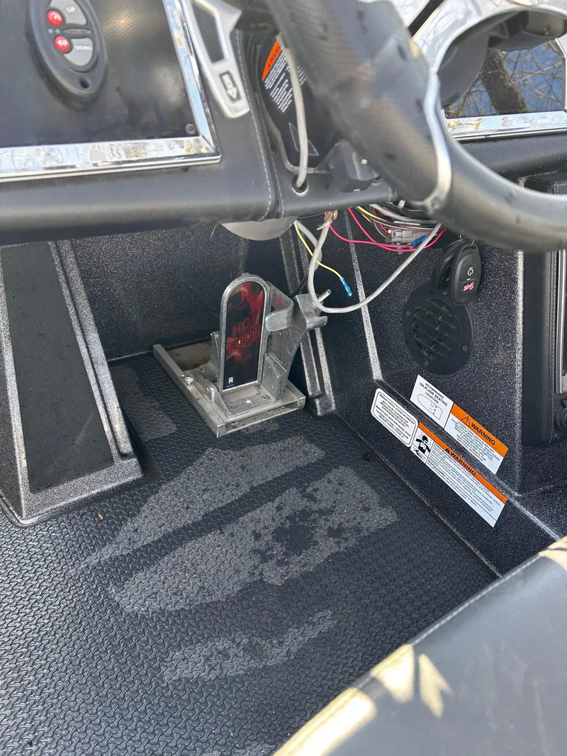 Slide: The Image of 2023 Ranger Z521R Ranger Cup Equipped boat cockpit with steering wheel and control panel. - 23