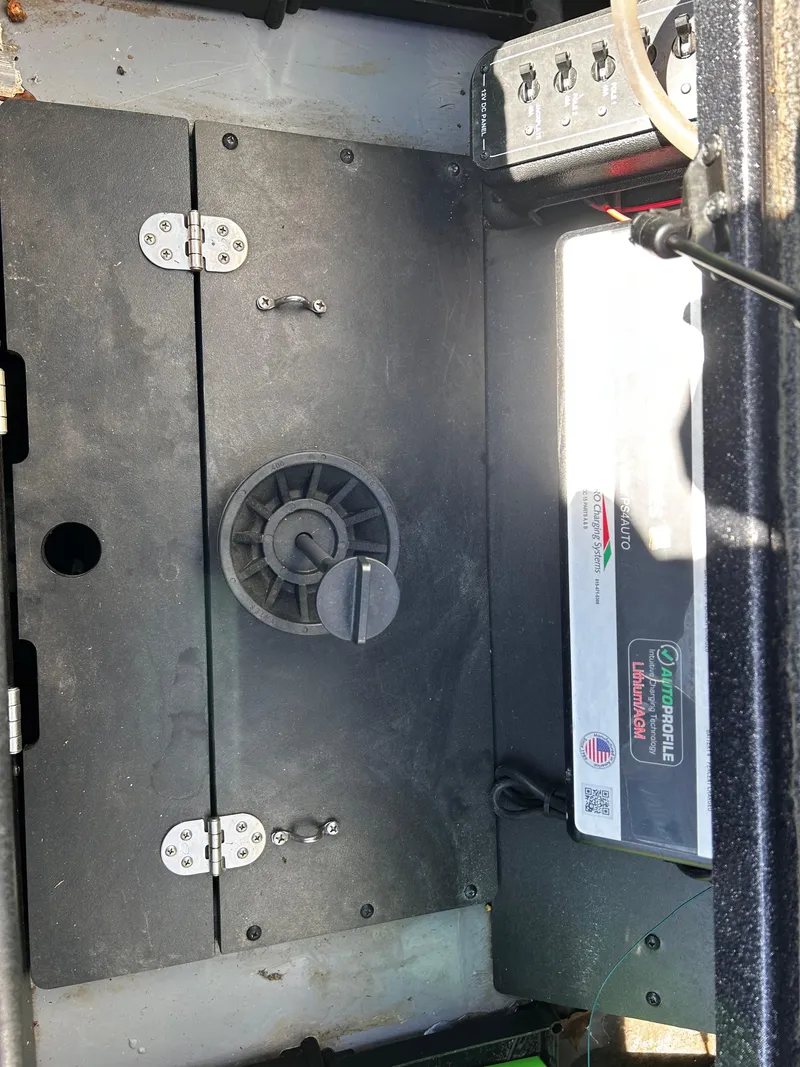 Slide: The Image of 2023 Ranger Z521R Ranger Cup Equipped boat interior with battery compartment and control panel. - 28