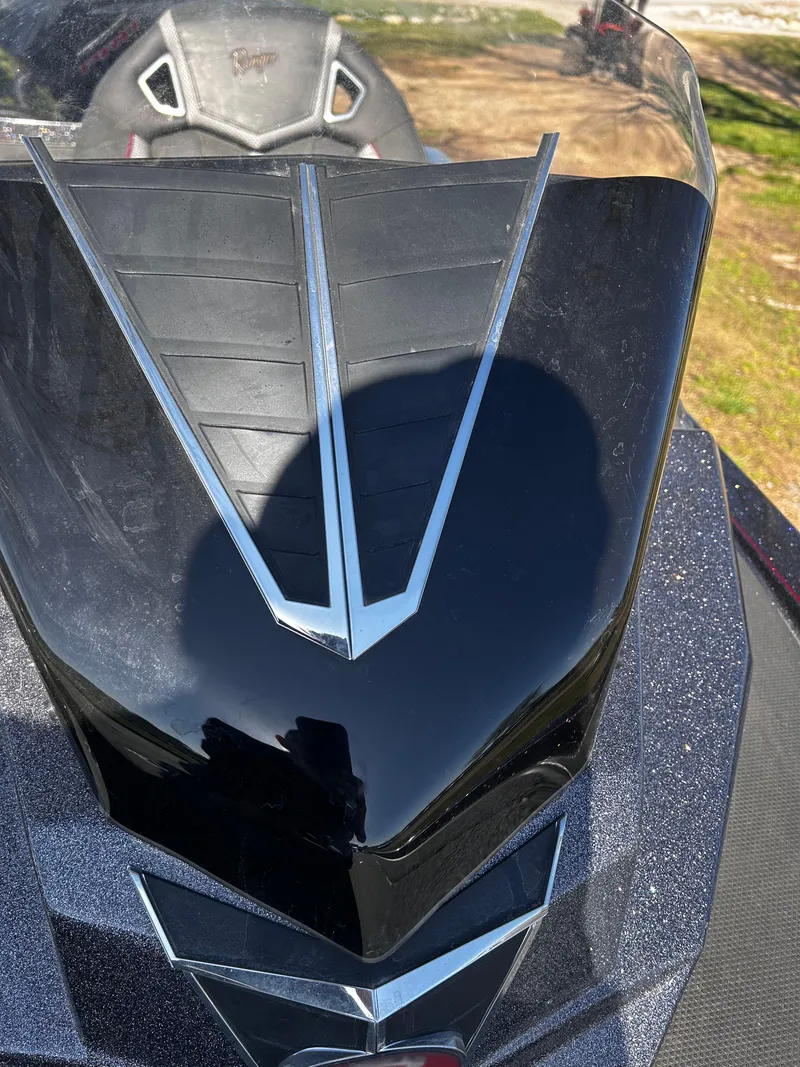 Slide: The Image of 2023 Ranger Z521R boat with sleek black design and modern detailing. - 36