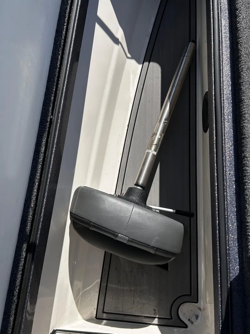 Slide: The Image of 2023 Ranger Z521R storage compartment with a metal handle tool inside. - 38