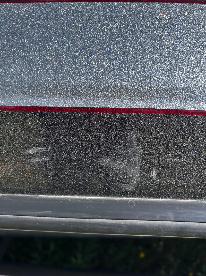 Slide: The Image of Close-up of 2023 Ranger Z521R Ranger Cup Equipped boat surface with metallic finish. - 6