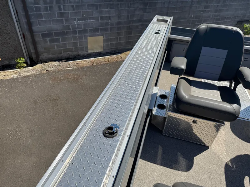 Slide: The Image of 2025 Fish Rite River Master 20 boat interior with seating and storage compartments. - 16