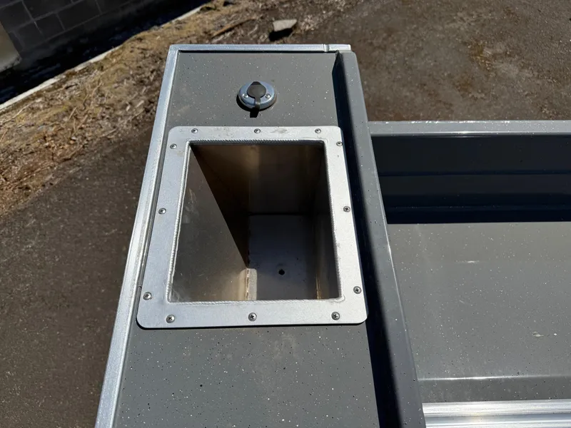 Slide: The Image of Fish Rite River Master 20 boat detail, 2025 model, showing a metal compartment. - 18