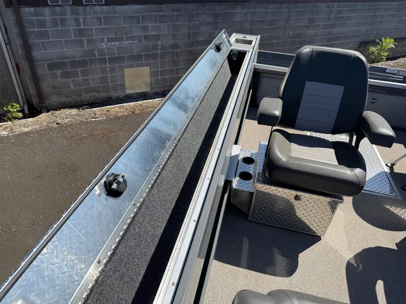 Slide: The Image of Interior of 2025 Fish Rite River Master 20 boat with seating and storage. - 20