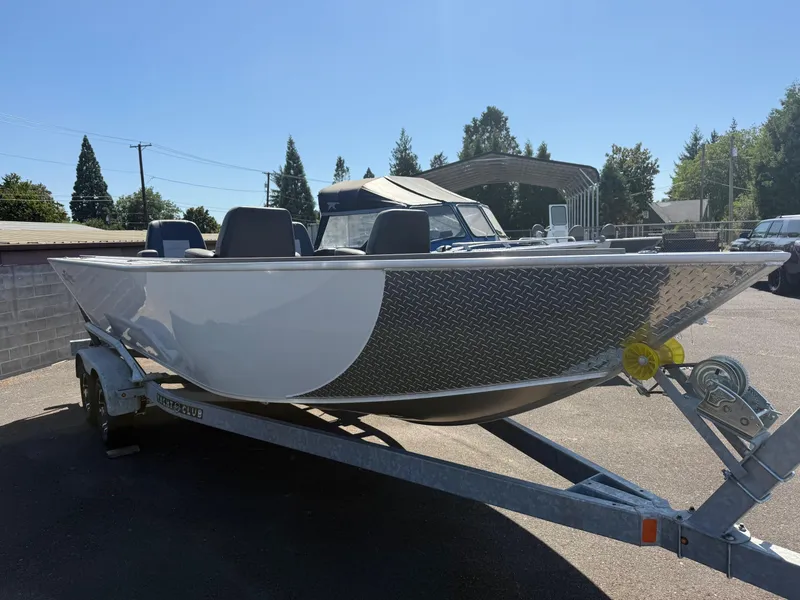 Slide: The Image of 2025 Fish Rite River Master 20 boat interior with seating and storage compartments. - 5