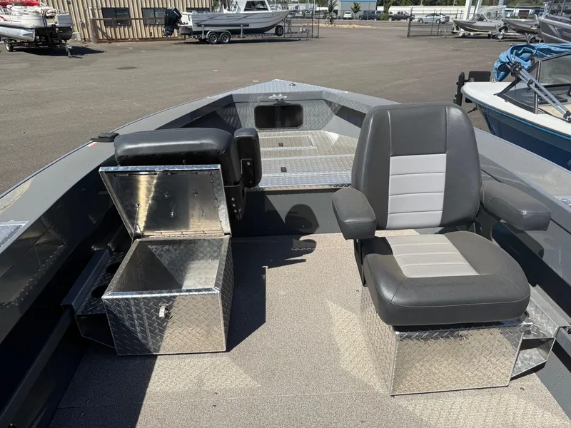 Slide: The Image of 2025 Fish Rite River Master 20 boat with open storage compartments on diamond plate deck. - 7