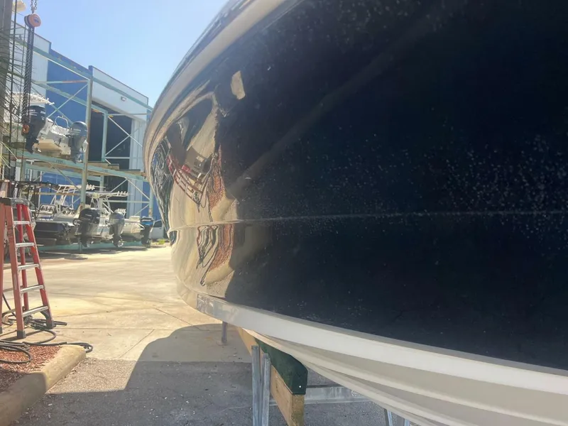 Slide: The Image of 2007 Sea Ray 240 Sundeck interior with steering wheel and cushioned seat. - 18