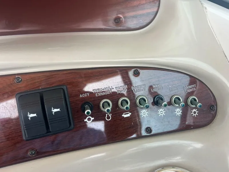 Slide: The Image of 2007 Sea Ray 240 Sundeck boat on a stand in a marina setting. - 23