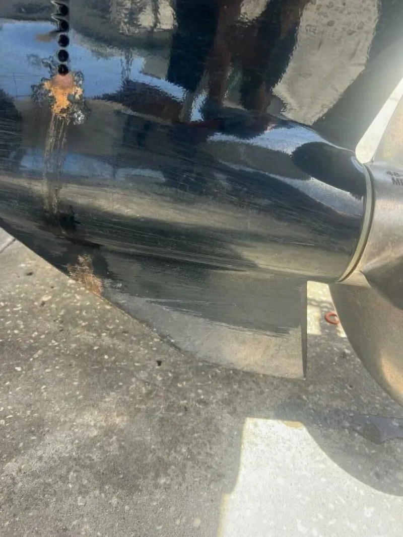 Slide: The Image of Close-up of a 2007 Sea Ray 240 Sundeck propeller with visible rust and wear. - 37