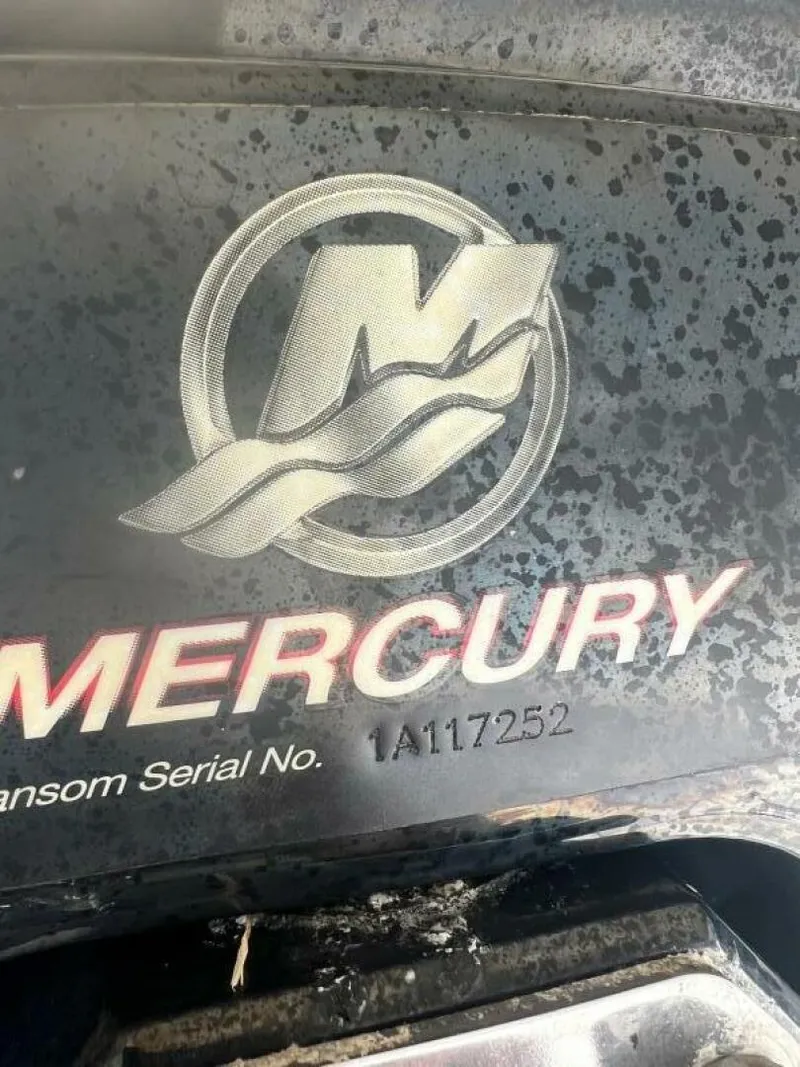 Slide: The Image of Mercury engine logo on a 2007 Sea Ray 240 Sundeck boat, serial number visible. - 38