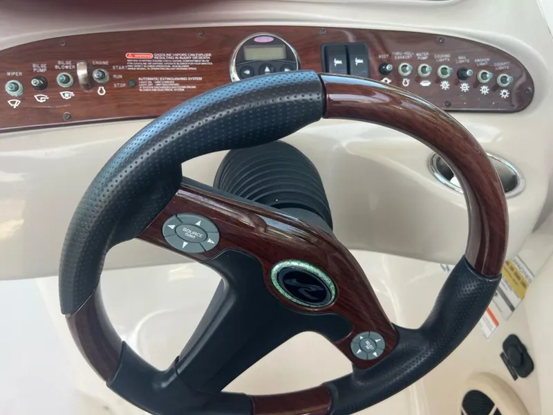 Slide: The Image of 2007 Sea Ray 240 Sundeck boat on display, featuring sleek design and swim platform. - 5