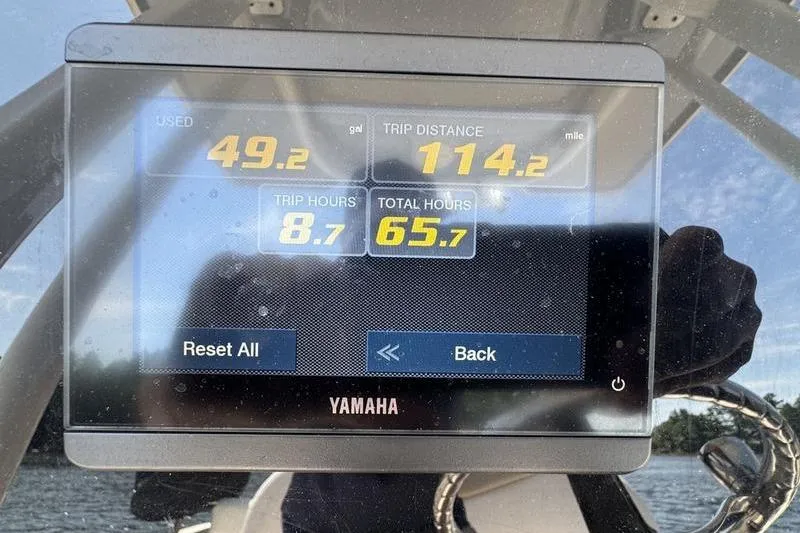 Slide: The Image of Yamaha display showing trip data on a 2021 Robalo R242 Center Console boat. - 1