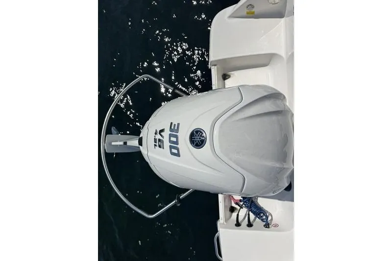 Slide: The Image of 2021 Robalo R242 Center Console with Yamaha 300 outboard engine on water. - 9