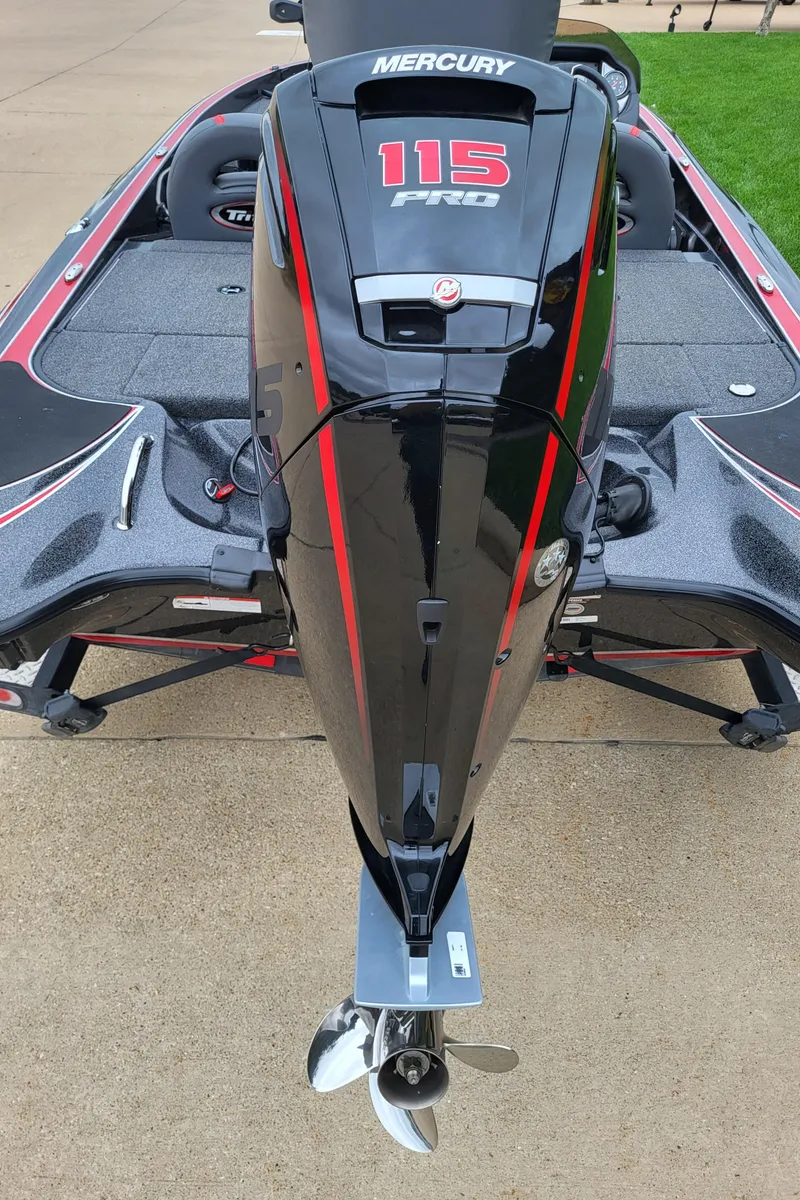 Slide: The Image of 2023 Triton 179 TrX boat with Mercury 115 Pro outboard motor, rear view. - 2