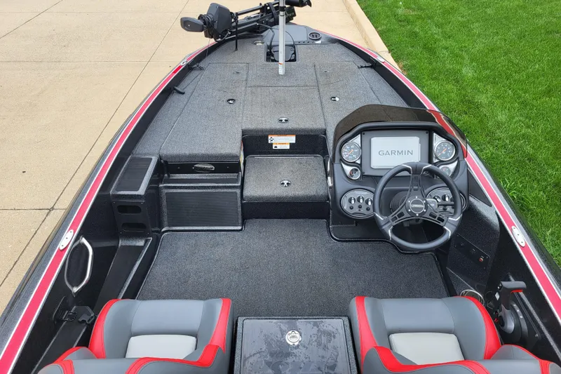 Slide: The Image of 2023 Triton 179 TrX boat interior with Garmin navigation system and dual seats. - 4