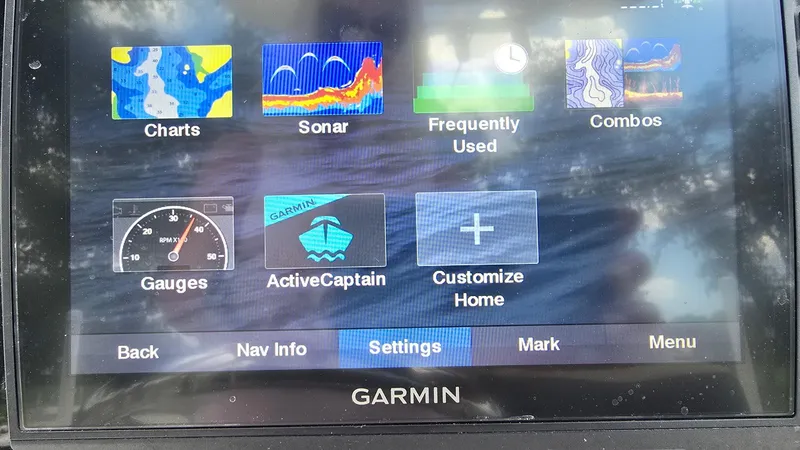 Slide: The Image of Garmin marine display showing navigation options on a 2021 Tidewater 2410 Bay Max. - 16