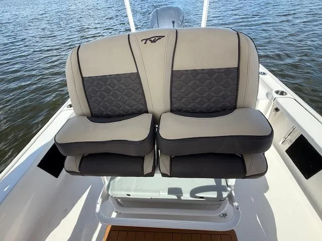 Slide: The Image of 2021 Tidewater 2410 Bay Max boat seats with quilted design on open water. - 20