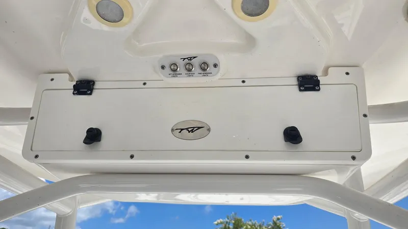 Slide: The Image of Tidewater 2410 Bay Max 2021 boat console with controls and storage compartment. - 22