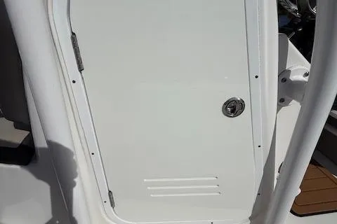 Slide: The Image of 2021 Tidewater 2410 Bay Max boat door with latch and hinges. - 26
