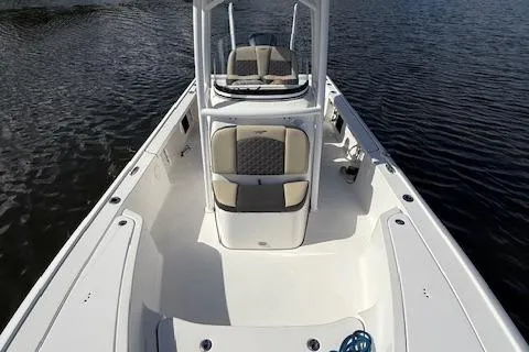 Slide: The Image of 2021 Tidewater 2410 Bay Max boat on calm water, showcasing spacious deck and seating. - 28