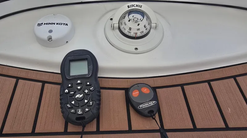 Slide: The Image of 2021 Tidewater 2410 Bay Max boat controls with Minn Kota and Power-Pole remotes. - 33